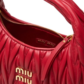 Miu Miu Wander Matelass&eacute; Crossbody Bag in Rosso red leather, open top view showing gold-tone zip, logo lettering and quilted interior
