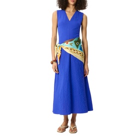 Model wearing Whistles blue sleeveless V-neck midi dress with textured fabric, styled with a printed scarf belt and tan sandals