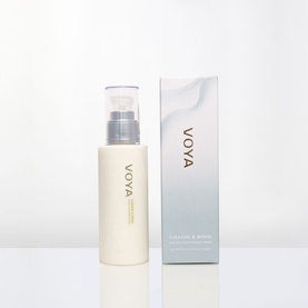 Voya Cleanser pump bottle in cream with clear cap, shown alongside pale blue branded gift box