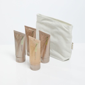Voya bodycare gift set with three tubes and a cream fabric pouch with Voya branding