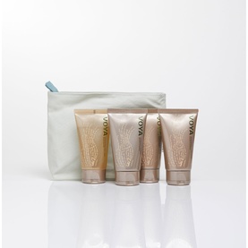 Voya bodycare gift set with four travel-sized tubes in golden tones and a pale blue zip pouch