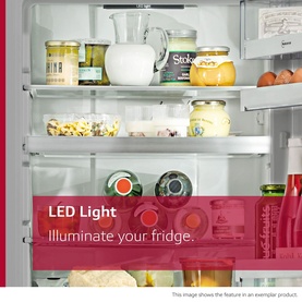 Neff N50 Integrated Larder Fridge interior showing LED lighting illuminating shelves stocked with food, drinks, and condiments.