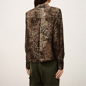 Model wearing Bash green leopard-print shirt, back view, with khaki trousers. Long sleeves, relaxed fit, button-front style.