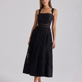 Model wearing House of CB black midi dress with square neckline, sheer mesh panels, and floral lace skirt detail