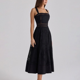Model wearing House of CB black midi dress with square neckline, strappy bodice, sheer waist panel and floral lace A-line skirt