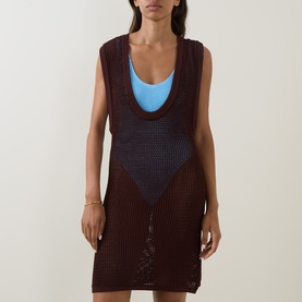 Model wearing Bond Eye walnut crochet mesh dress over blue swimsuit, sleeveless open-knit design with scoop neckline