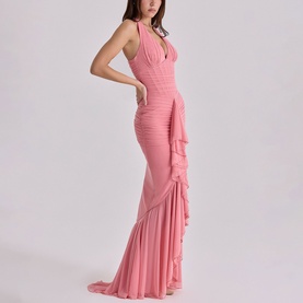 Model wearing House of CB raspberry halterneck maxi dress with deep V-neckline, ruched bodice, and ruffle fishtail hem