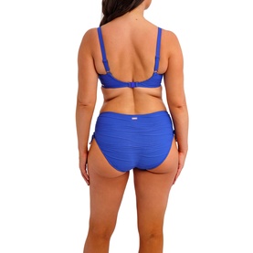 Model wearing Fantasie bikini top and high-waist briefs in Ultramarine, back view showing ruched texture and adjustable straps