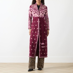 Model wearing Hayley Menzies Dalton Bandana Print Duster Cardigan in burgundy, maxi length with fringe trim, styled with leopard print trousers