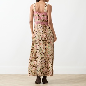 Model wearing Hayley Menzies Talitha Silk Leopard Dress in multi, rear view showing wide straps, lace trim, and flared maxi skirt