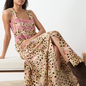 Model wearing Hayley Menzies Talitha Silk Leopard Dress in multi, featuring square neckline, lace trim, leopard and rose print, maxi length