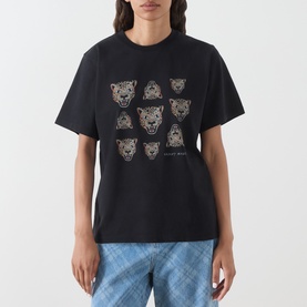 Model wearing Hayley Menzies black cotton T-shirt with embroidered leopard head graphic print, styled with blue checked trousers