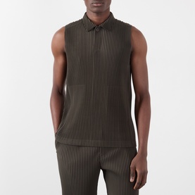 Model wearing Issey Miyake Brown Pleated Polo Shirt, sleeveless with polo collar, styled with matching brown pleated trousers.