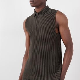 Model wearing Issey Miyake Pleated Polo Shirt in brown, sleeveless with polo collar, fine vertical pleating throughout