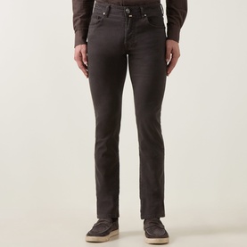 Model wearing Jacob Cohen Bard Straight Leg Jeans in brown, five-pocket style with belt loops, paired with brown suede loafers.