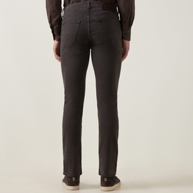 Model wearing Jacob Cohen Bard Straight Leg Jeans in F44 Brown, rear view showing leather logo badge and handkerchief pocket detail.