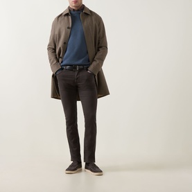 Model wearing Jacob Cohen Bard Straight Leg Jeans in brown, styled with a taupe overcoat, blue rollneck, and dark trainers.