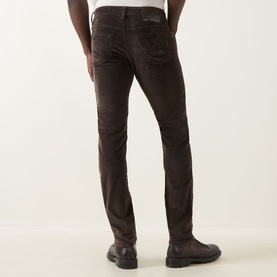 Model wearing Jacob Cohen Bard Corduroy Straight Leg Trousers in brown, rear view, styled with dark leather shoes.