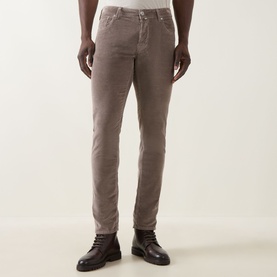 Model wearing Jacob Cohen 3049 Cord Jeans in Elephant Grey, slim fit, styled with dark leather lace-up boots.