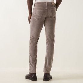 Model wearing Jacob Cohen 3049 Jeans in Elephant Grey corduroy, slim fit, styled with dark leather shoes. Rear view.