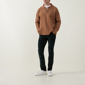 Model wearing Jacob Cohen Bard Corduroy Straight Leg Trousers in T89 Green, styled with a camel zip-neck sweatshirt and white trainers.