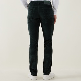 Model wearing Jacob Cohen Bard Corduroy Straight Leg Trousers in T89 Green, rear view showing logo patch and corduroy texture, styled with white
