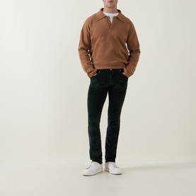 Model wearing Jacob Cohen Bard Corduroy Straight Leg Trousers in T89 Green, styled with a camel polo sweatshirt and white trainers.