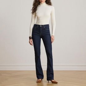 Model wearing Lauren Mascarpone Cream ribbed turtleneck knit top, styled with dark indigo flare jeans and brown heeled mules
