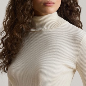 Model wearing Lauren mascarpone cream ribbed knit turtleneck, close-up detail of neckline and fitted silhouette