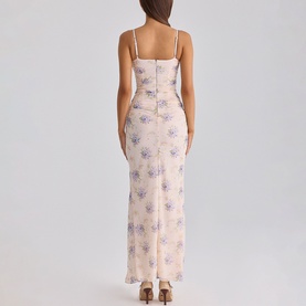Model wearing House of CB Ivory Peony Print maxi dress with spaghetti straps, fitted silhouette and floral print, back view.