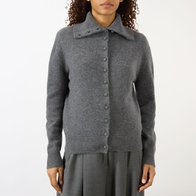 Model wearing Lisa Yang The Denie Knit Cardigan in Graphite, featuring extended flat collar, button fastening and ribbed trims, styled with grey
