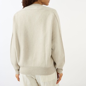 Model wearing Lisa Yang The Hally Cashmere Sweater in Oyster, back view, crew neck, long sleeves, ribbed trims, styled with matching trousers