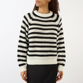 Model wearing Lisa Yang cream and black stripe cashmere silk knit jumper with relaxed fit, styled with black mini skirt.