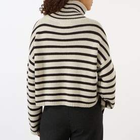 Model wearing Lisa Yang Zerlina Striped Turtleneck Sweater in Oyster/Dark Oak Stripes, showing ribbed turtleneck, long sleeves and straight hemline,