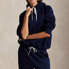 Model wearing Polo Ralph Lauren Cruise Navy hoodie with white drawstring, styled with matching navy joggers