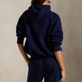 Model wearing Polo Ralph Lauren Cruise Navy hoodie, back view, styled with matching navy joggers