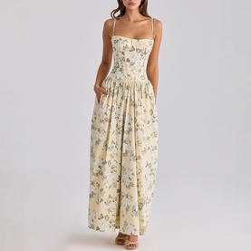 Model wearing House of CB taupe floral print strappy maxi dress with sweetheart neckline and gathered skirt