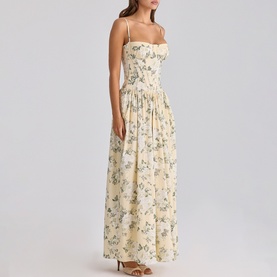 Model wearing House of CB taupe floral print strappy maxi dress with fitted bodice and full pleated skirt