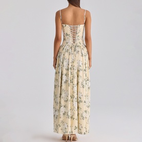 Model wearing House of CB taupe floral maxi dress with spaghetti straps and lace-up back detail, full skirt silhouette