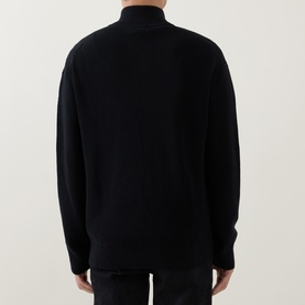 Model wearing Calvin Klein Jeans Badge Logo Waffle-Knit Half-Zip Sweatshirt in black, back view showing dropped shoulders and ribbed trims