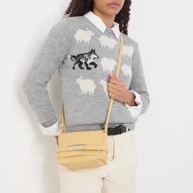 Model carrying Longchamp Le Smart S Crossbody Bag in Foin, gold-tone hardware, worn crossbody. Styled with grey sheep-print jumper and cream trousers.