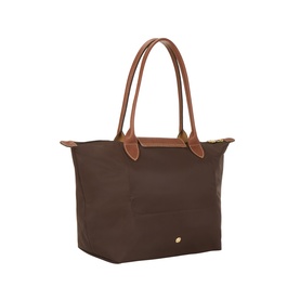 Longchamp Moka polyamide shoulder tote bag with tan leather handles and gold stud detail, angled view