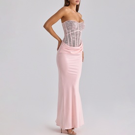 Model wearing House of CB pink strapless maxi dress with lace corset bodice and satin mermaid skirt