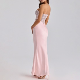 Model wearing House of CB pink strapless maxi dress with lace corset bodice and satin skirt, shown from the back