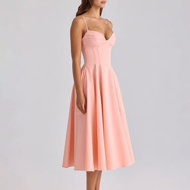 Model wearing House of CB peach midi dress with sweetheart neckline, thin straps, fitted bodice and full A-line skirt