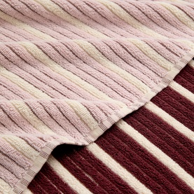Christys bath towelling in multi colourway, showing ribbed texture in cream, blush pink, and deep burgundy stripe layers