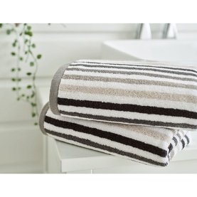 Deyongs Linear Stripe Towel Chrome, two folded towels in cream, taupe and black horizontal stripes, styled in a bathroom setting.