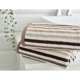 Deyongs Linear Stripe Towel Natural in cotton, showing brown, beige and white horizontal stripes, styled on a bathroom surface