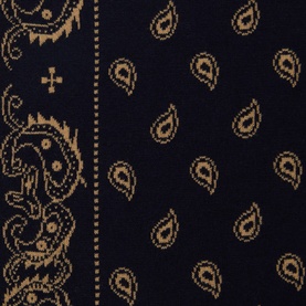 Guest In Residence scarf in black and gold paisley pattern, cotton-silk blend, flat lay detail view showing repeat motif and border design.