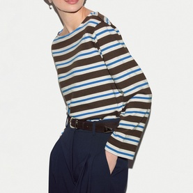 Model wearing Jigsaw brown multistripe long sleeve top with navy trousers and brown belt.